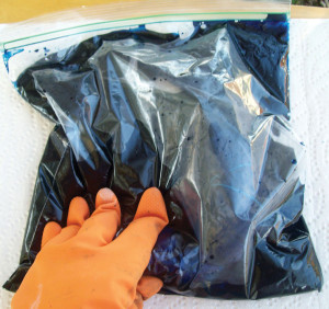 Gently massage the fabric inside the bag.